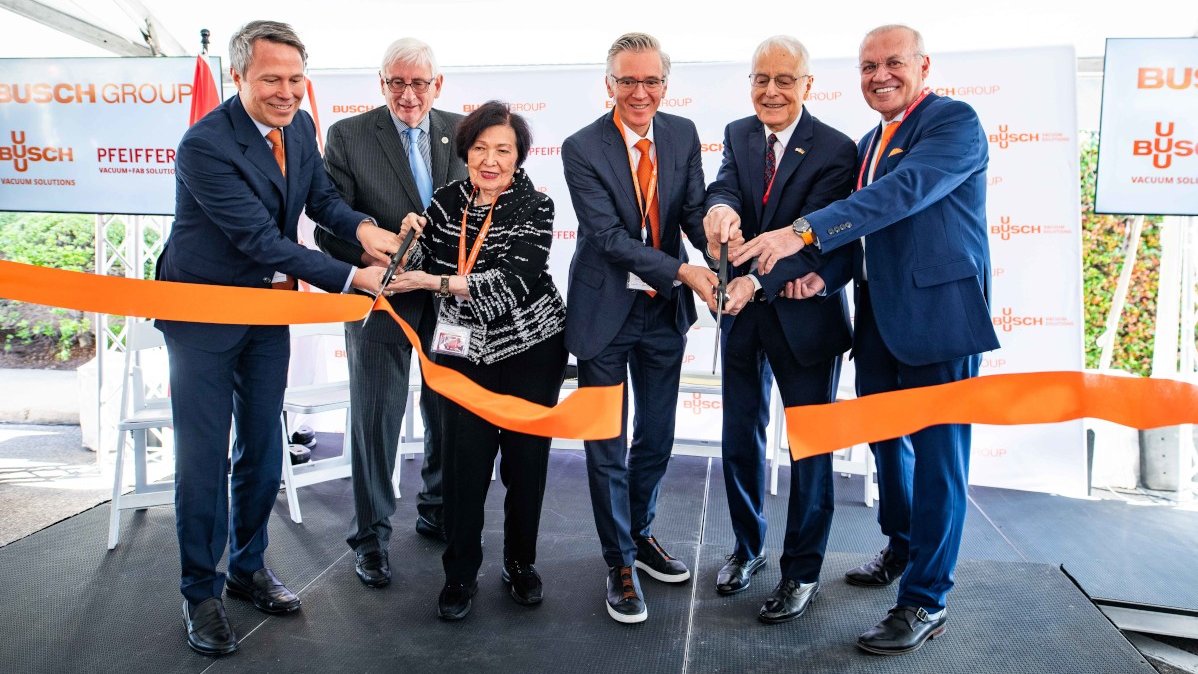 The Busch family and company management cut a ribbon to officially reopen the renovated headquarters. 